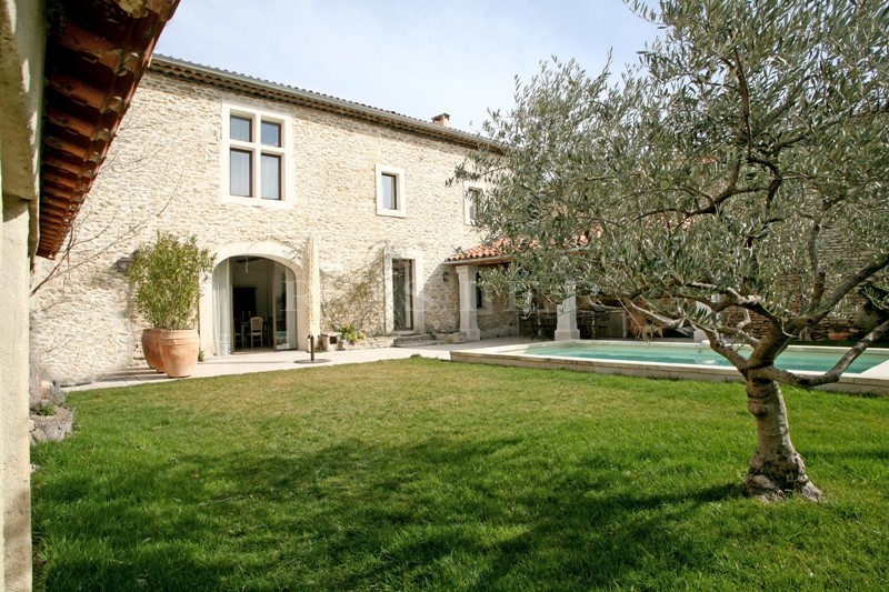 In the Luberon, for sale, a five bedroomed house at the heart of a village with garden and swimming pool