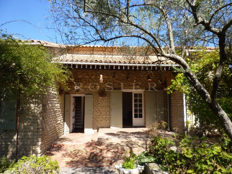 Near the beautiful hill top village of Gordes in Luberon, for sale, charming stone villa with a garden of 6000 m² with olive trees and swimming pool 