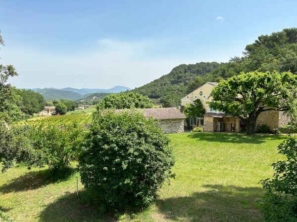 EXCLUSIVITY - Vaucluse : old stone farmhouse for sale with view on the vineyards in Entrechaux