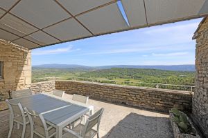 In Gordes, contemporary village house enjoying breathtaking views of the Luberon Mountains.