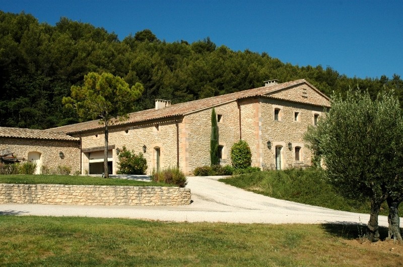 In Luberon, for sale, high end property, approximately 3 000 m²,  with 33 hectares with vineyards, wood, olive trees. 