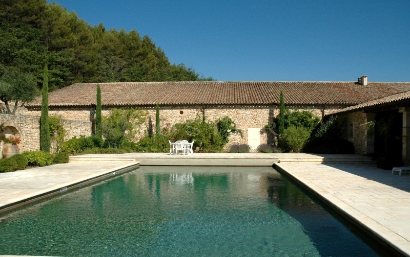 In Luberon, for sale, high end property, approximately 3 000 m²,  with 33 hectares with vineyards, wood, olive trees. 