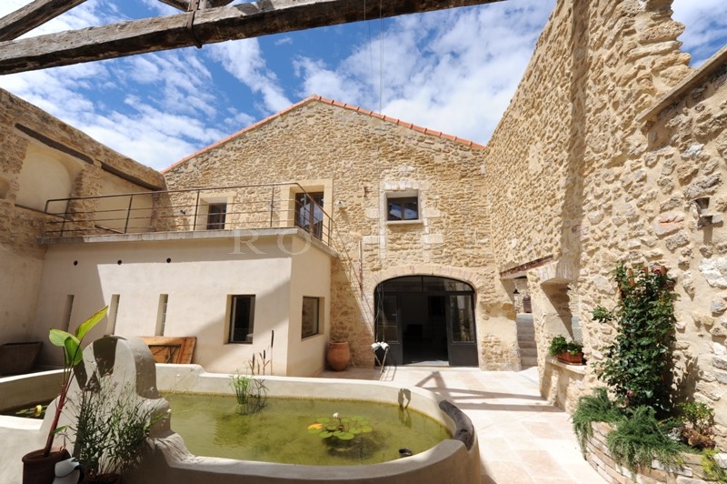 For sale, near Avignon, former factory entirely renovated, very contemporary with patio, fountain and swimming pool