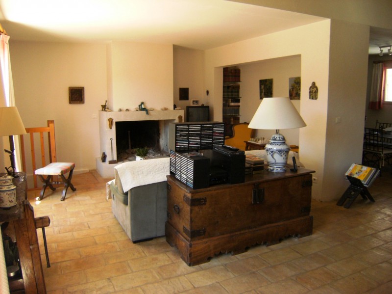 In Gordes, for sale, stone house with terraces overlooking a park with pool